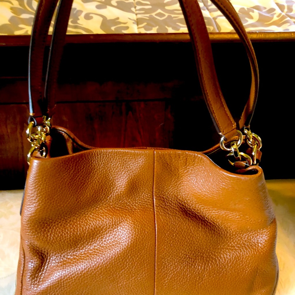 New, never used brown leather Coach satchel